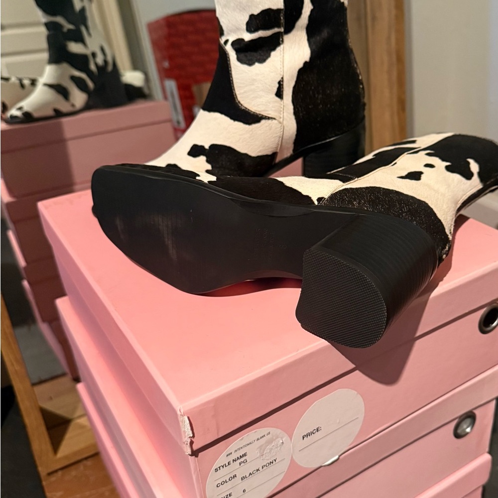 Intentionally Blank Cow print bootie. These shoes are fun and beautiful.